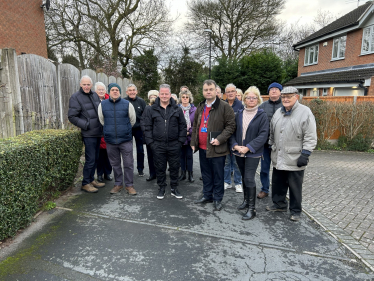 Cllr Gary Ridley (green jacket, centre) next to Cllr Julia Lepoidevin with residents at the narrow site of the proposed access route into the development on High Beech. Cllr Peter Male is second from left.